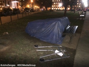 A disabled homeless person stays in a makeshift hootch a block from the White House