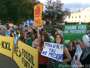 Opponents of the Keystone XL Pipeline celebrate in front of the White House./Photo by John Zangas