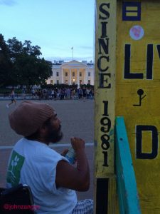 With community support, Philipos Melaku-Belo tends the 24-hour White House Peace Vigil.