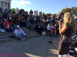 Claudia Stauber addresses the Reclaim Democracy audience on the steps on the Lincoln Memorial./Photo by John Zangas