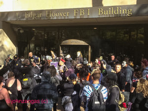 Protesters surround front door of FBI building, several arrested./Photo by John Zangas