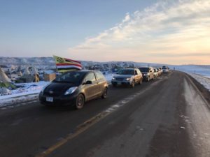 Hundreds of cars with veterans stream into Oceti Sakowin camp/Photo by Dennis Trainor